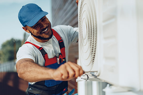 man installing air conditioner